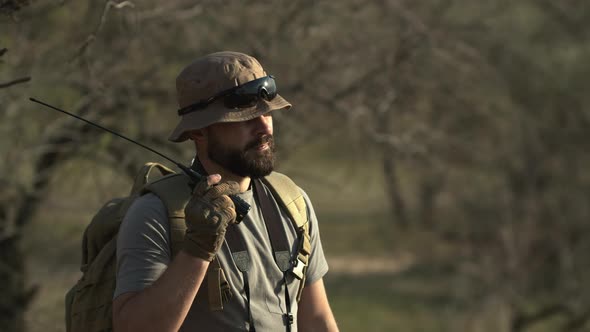 Outdoor Shot of Bearded Man Solder Standing in Field and Guarding Terrirory Wearing Military alt