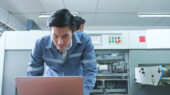 specialist worker engineer team control and operate printing package lable machine alt