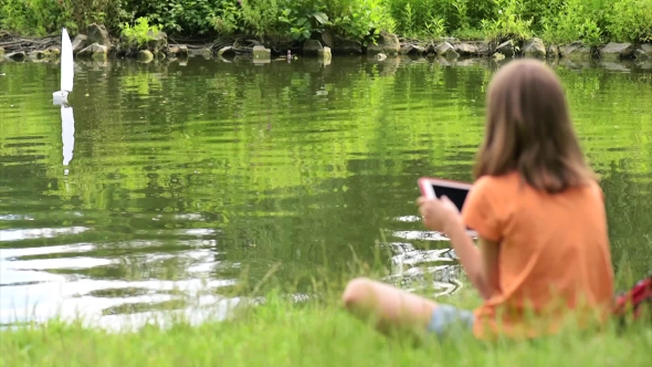 Girl With Remote Controlled Boat