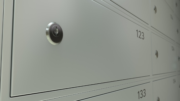 Safe Deposit Boxes In a Bank And The Key. Shallow Focus  Dolly Shot alt