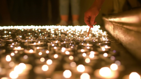 Lighting Up Candles Of Prayer