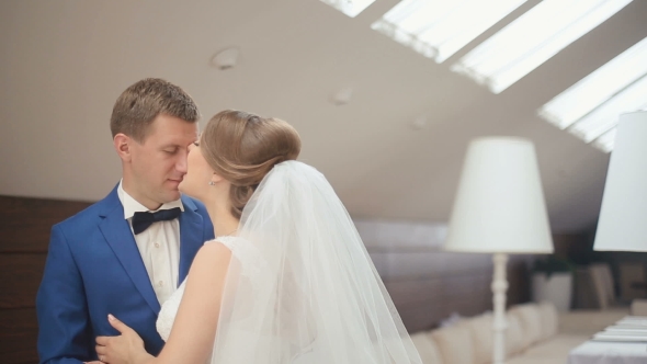 Cute Married Couple In The Luxurious Cafe.  Funny Moment Of Groom And Bride Softly Smiling And