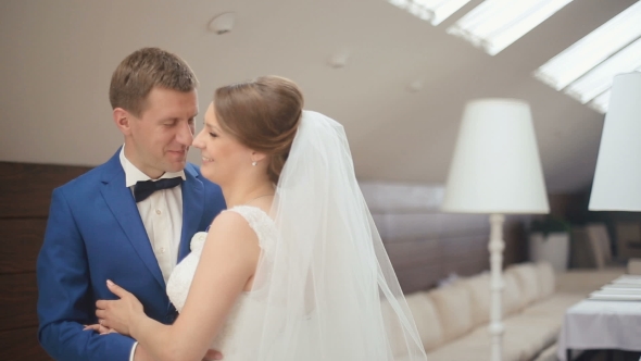 Funny Moment Of Groom And Bride Softly Smiling And Flirting With Each Other. Luxurious Cafe