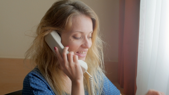 Blonde In Hotel Room Calling By Landline Phone