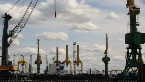 timelapse of a seaport with cranes, ships, containers and cargo in Saint-Petersburg, Russia