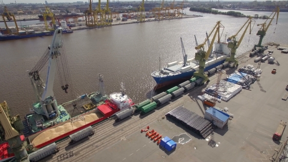 Aerial view of cargo ship in the port awaiting loading