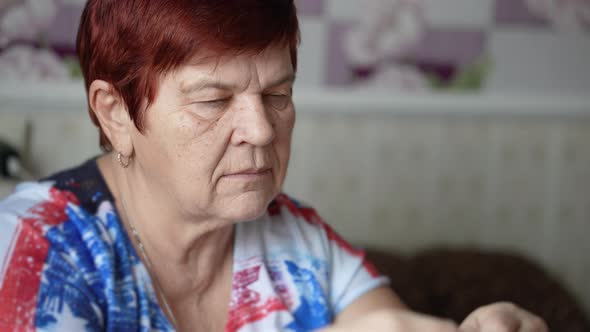 Senior Woman Taking Pill Having Health Problem alt