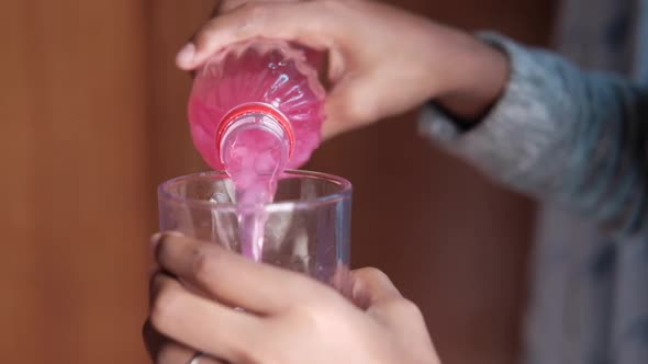Pouring Soft Drinks From a Bottle Slow Motion alt