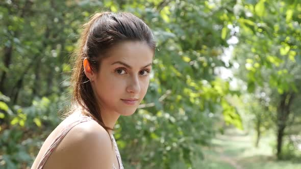 Self confident female oudoor portrait slow motion footage alt