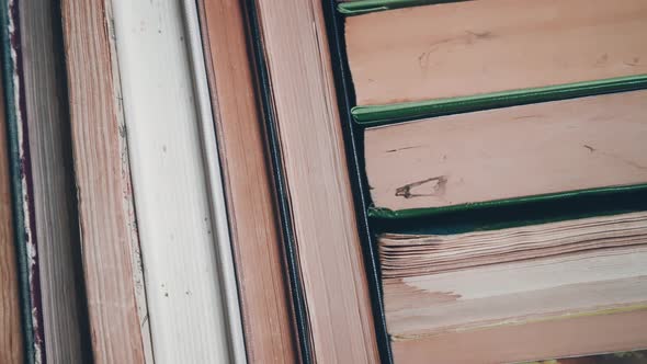 Bookshelf with old shabby books. Concept on the theme of history, nostalgia, old age. alt