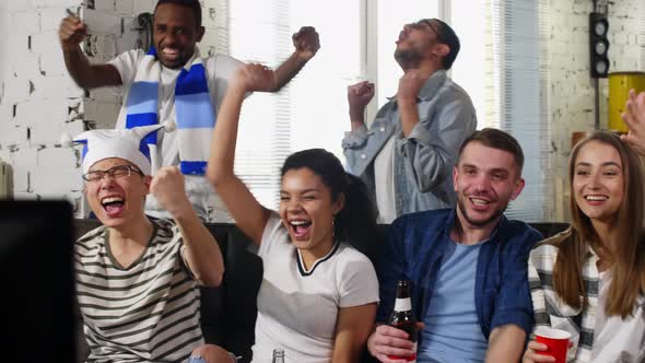 Lovers watching TV match with friends