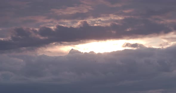 The Sun Hides Behind Thick Clouds alt