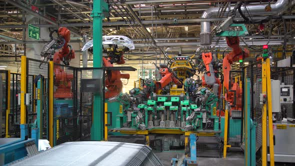 Industrial Robots Working In  Car Factory