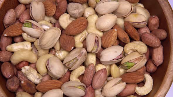 Close Up. Background of Nuts. Different Types of Nuts Rotate in a Circle