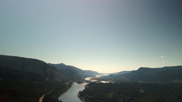 Bird'seye View of the Sunrise Over the River with Hilly Terrain alt