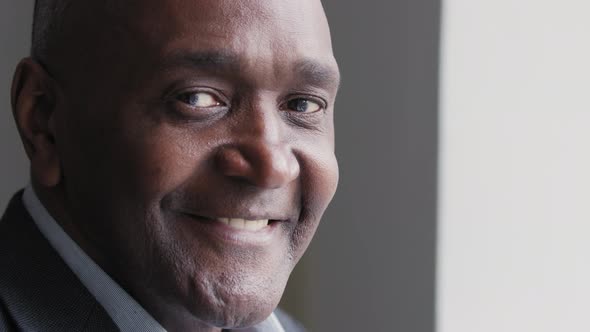 Male Portrait of African American Mature Afro Man with Pensive Dreamy Expression on Face Wrinkled alt