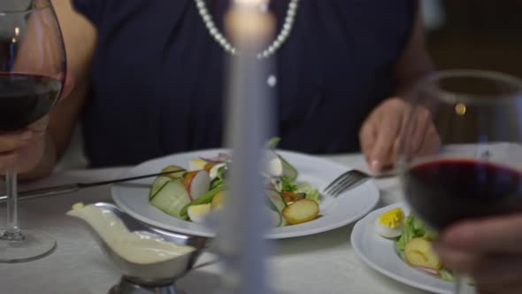 Senior Couple Having Dinner in Restaurant alt