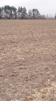 Vertical Video of a Field with Plowed Land in Autumn Slow Motion alt