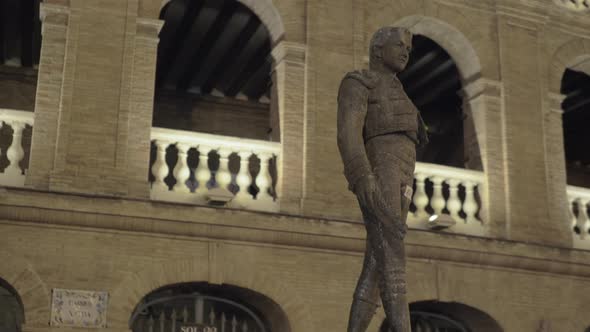 Night view of Plaza de Toros with statue of Toreador Manolo Montoliu, Valencia alt