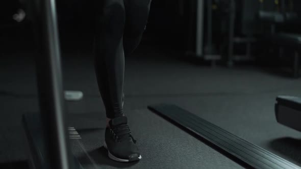 Female Athlete Run on a Treadmill Aerobic Exercise and Endurance Training in the Gym  Slow Motion alt