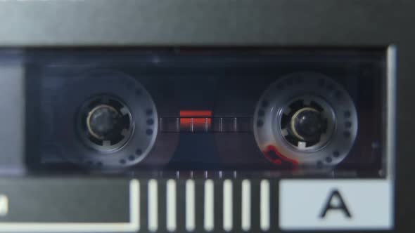 Rotating Reels Of Cassette In Player