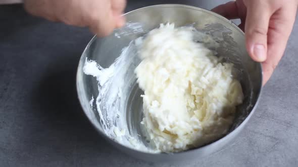 Chef prepares filling for pie with cottage cheese