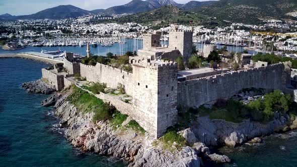 Amazing panoramic view from drone of full of yachts Bodrum harbour and ancient Kalesi castle. alt