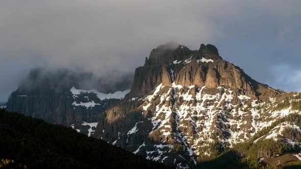 Time lapse of Amphitheater Mountain as clouds roll over top alt