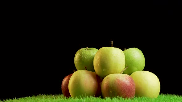 Pile of Shiny,vibrant Apples on Green Rotating Surface