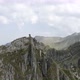 Man Standing on top of a Cliff in Rocky Mountains - VideoHive Item for Sale