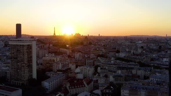 Aerial view of Paris France skyline rooftops sunset.  alt