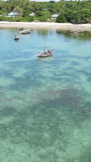 Vertical Video Boats in the Ocean Near the Coast of Zanzibar Tanzania alt