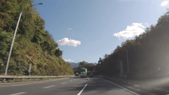 Big Trucks on the Side of the Road in a Traffic in Japan