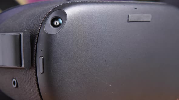 Close-up of a black virtual reality helmet with cameras and sensors alt