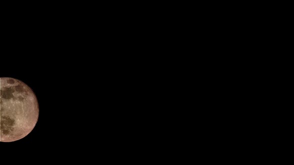 Night time lapse of the full moon alt