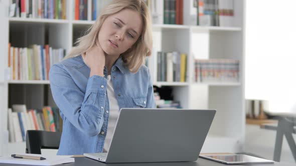 Tired Woman with Neck Pain Working on Laptop alt