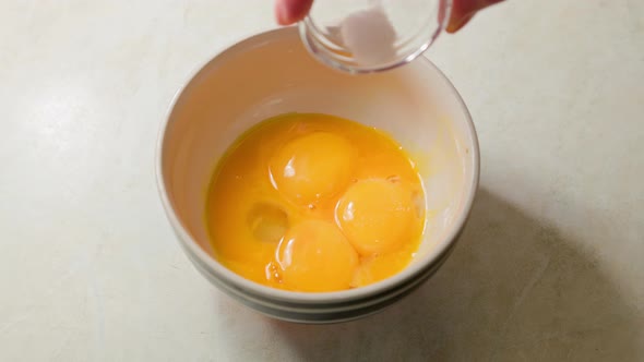 White Woman Salt Egg Yolks in a Bowl