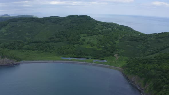 Mayachny Cape on Kamchatka Peninsula on Picturesque Avacha Bay Coast Covered By Green Grass in the