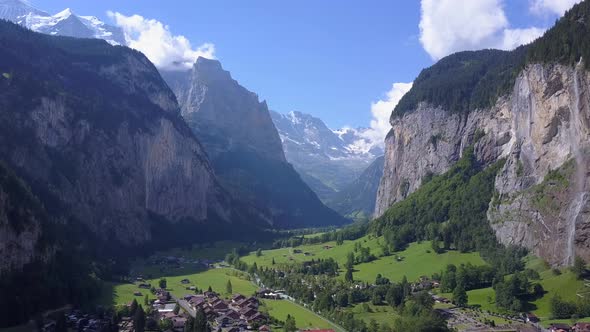 Aerial travel drone view of the Lauterbrunnen Valley and Staubbach Falls, Switzerland. alt