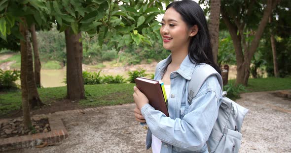 Asian Woman Student Walking alt