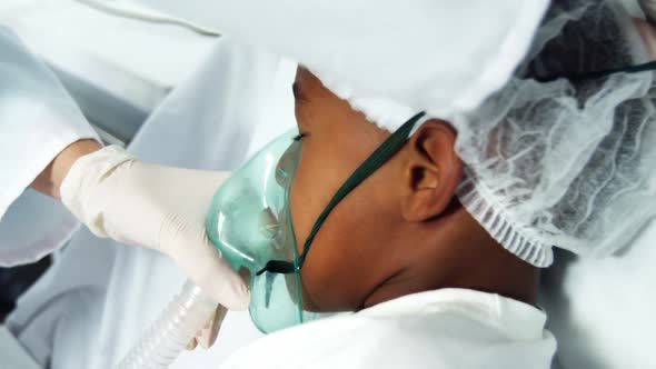 Doctor examining a patient alt