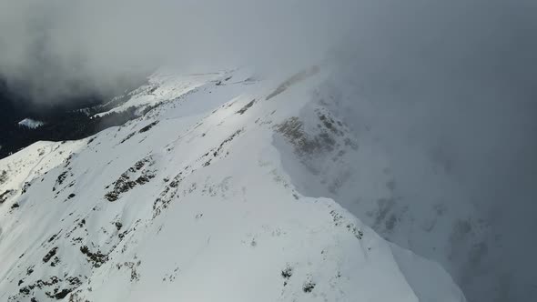 Drone View of the Slopes of the Black Pyramid Mountain in Winter Covered in Snow alt