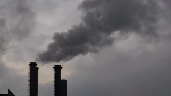 Factory Smokestack Emitting Smoke Against Sky  Environmental Pollution