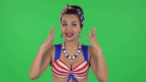 Portrait of Beautiful Surprised Girl in a Swimsuit Is Saying Oh My God Then Wow. Green Screen alt