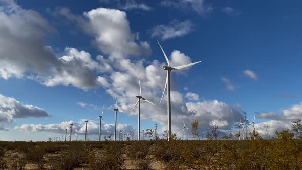 Driving past massive wind turbines in the California desert alt