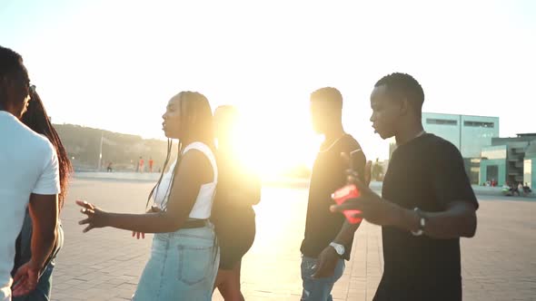 Group of Young Modern African Black Friends Happily Walking Together alt