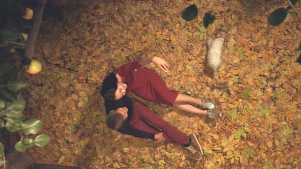 Young Couple with Dog are Photographed Themselves