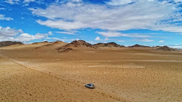 Car Rides Through the Sandy Desert