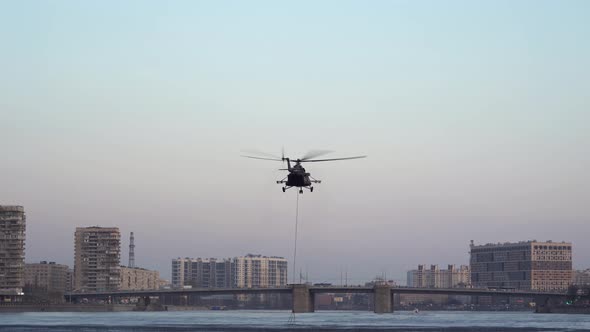 Helicopter Picks Up Bambi Bucket in River