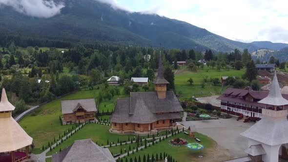 Monastery In Mountains Aerial View alt